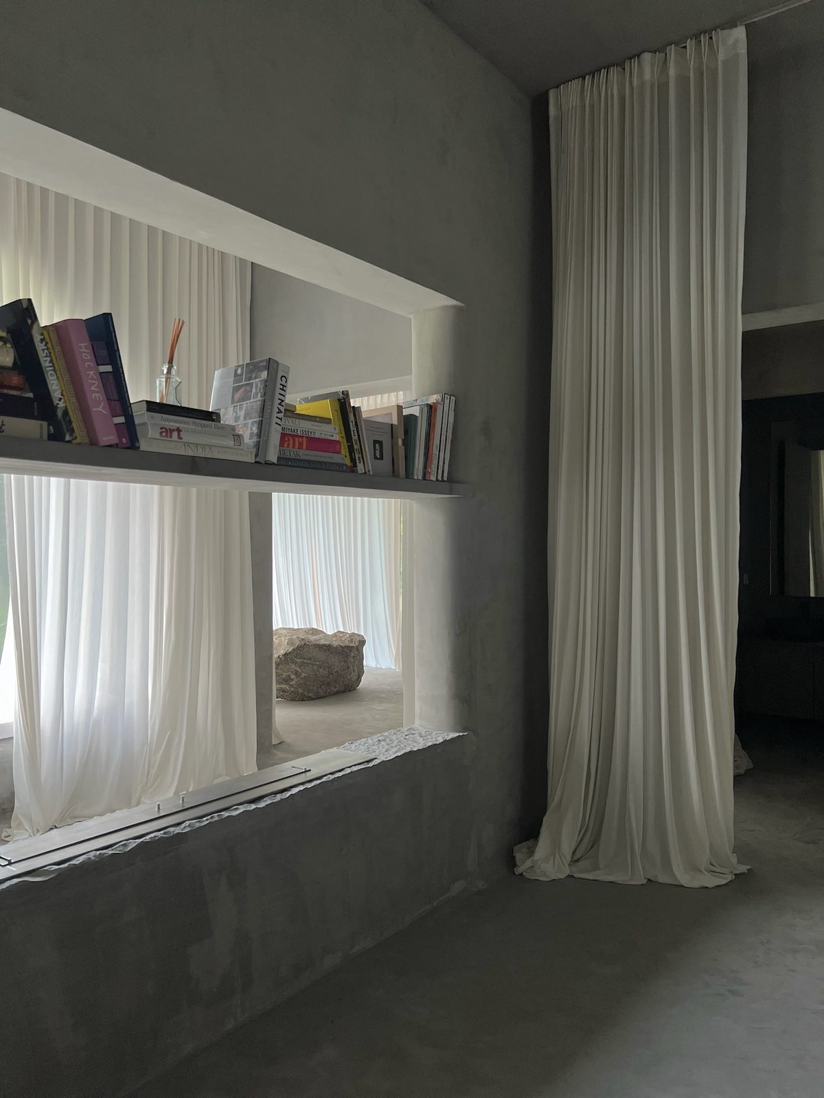 shelves set into the concrete wall