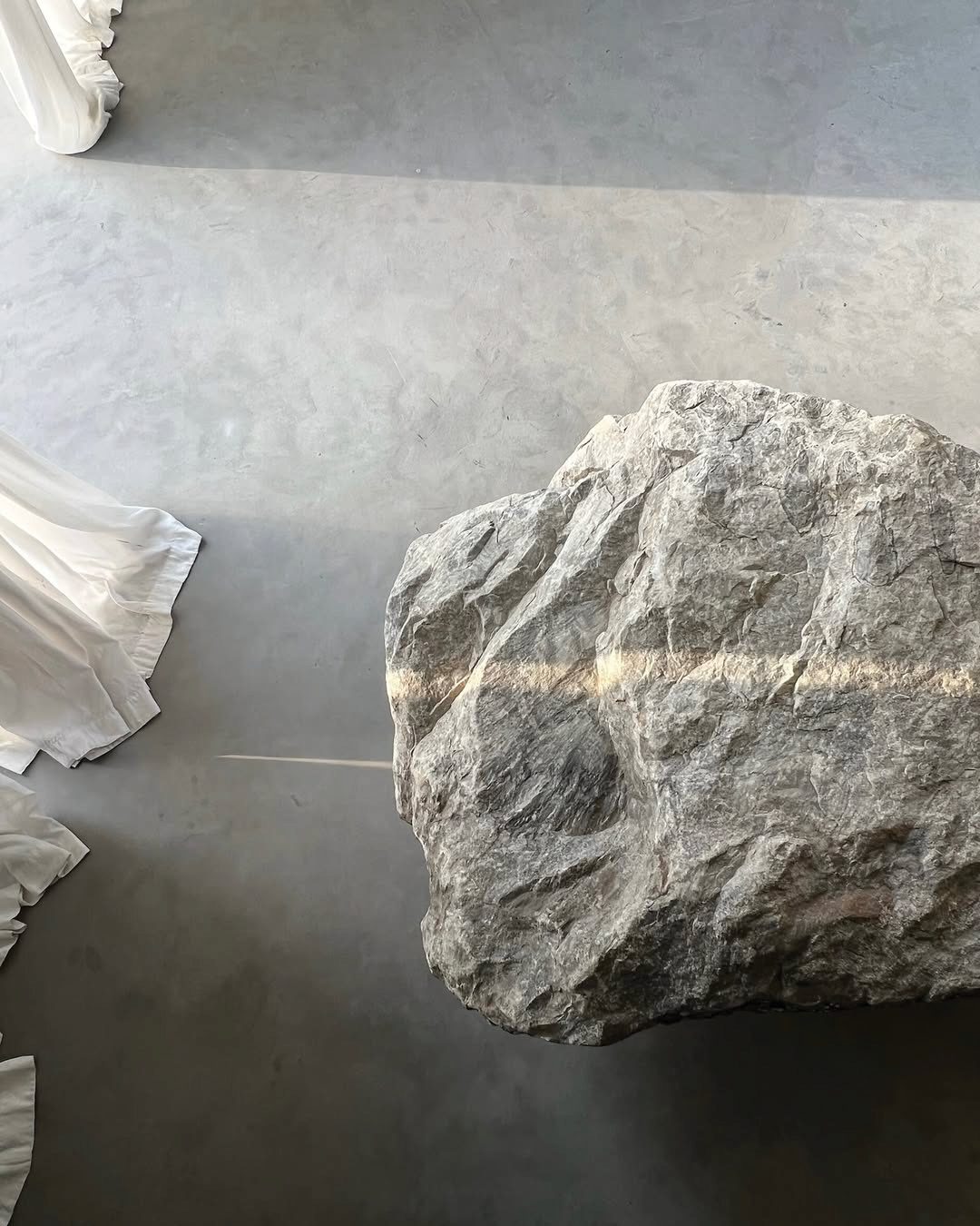 a stone on the concrete floor